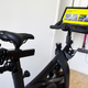 View of seat, weights, resistance knobs, screen and handlebar